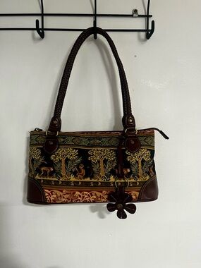 Relic monkey and forest shoulder purse.